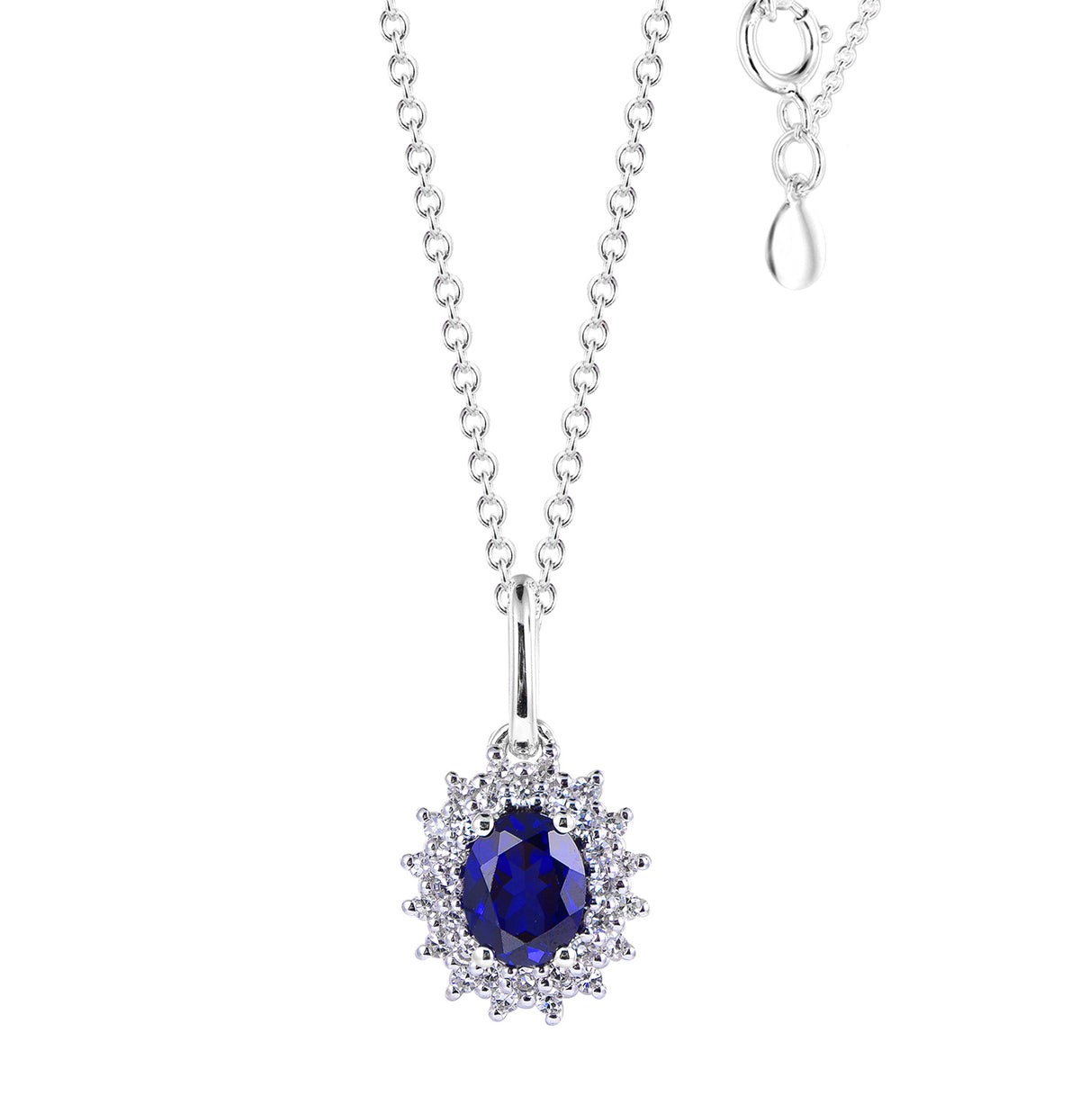 14K white gold pendant featuring an oval blue sapphire surrounded by a halo of diamonds.